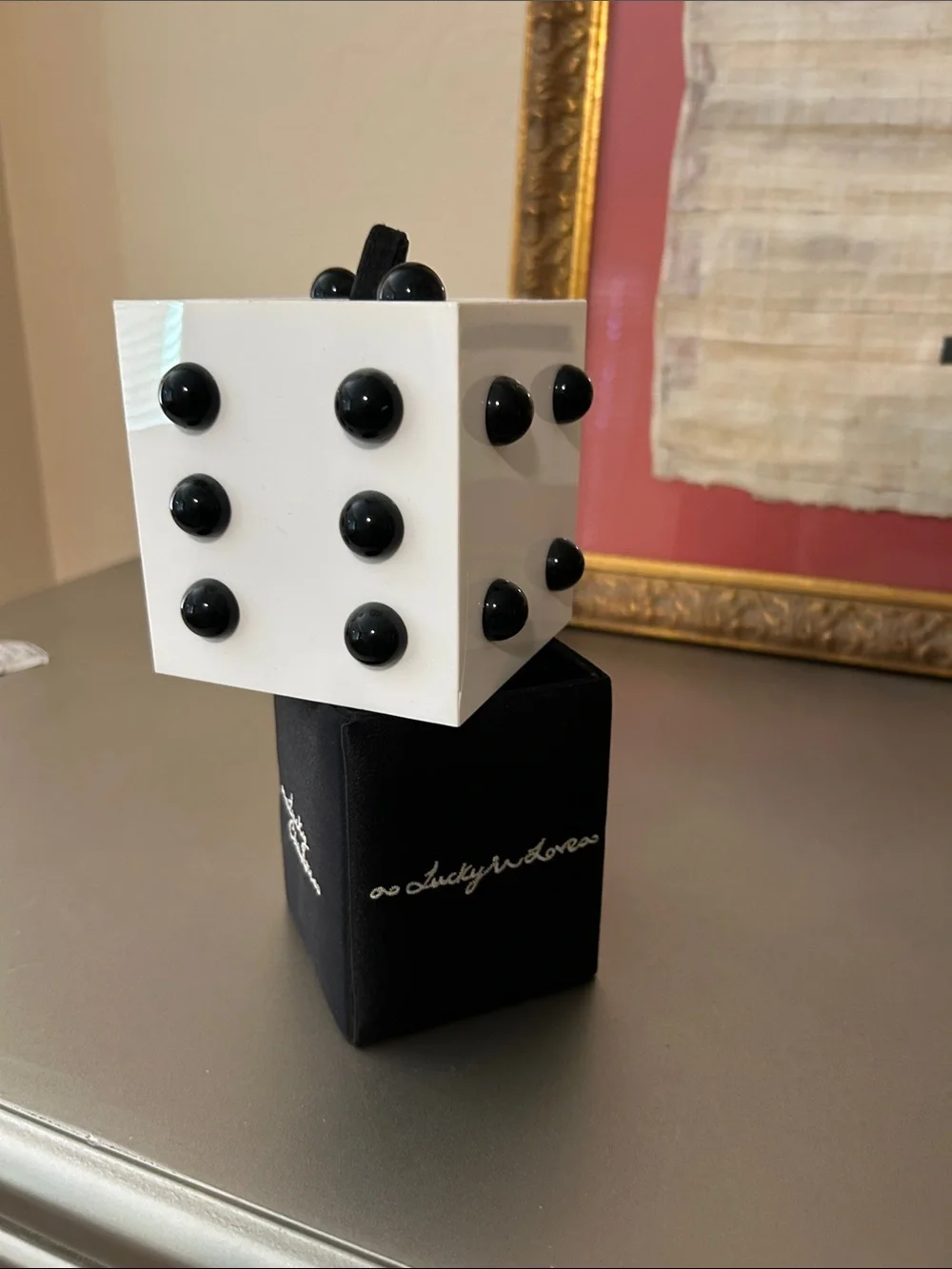 Lulu Guinness wristlet that looks like a dice cube.